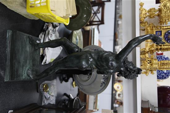 After the antique. A modern green patinated bronze model of a dancing faun, 32.5in.